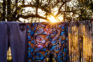 colorful rural clothes on a drying rack during sunset