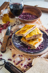Lobiani - traditional dish of Georgian food. Baked closed pie or bread with white lobio or red beans filling. Eat for Barbaroba holiday or Christmas and New Year. Served with red whine, oil, ajika.