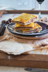 Lobiani - traditional dish of Georgian food. Baked closed pie or bread with white lobio or red beans filling. Eat for Barbaroba holiday or Christmas and New Year. Served with red whine, oil, ajika.