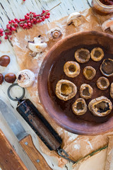 Roasted, baked mushrooms called Gryba in clay dish (ketsi - georgian traditional) with sunflower...