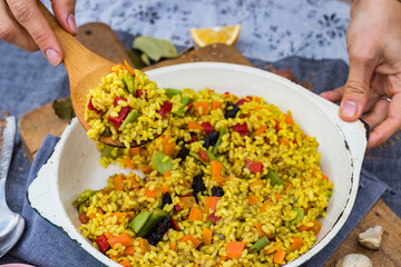Pilaf, pilau - colorful Indian basmati rice with vegetables and turmeric. Vegan vegetarian healthy...