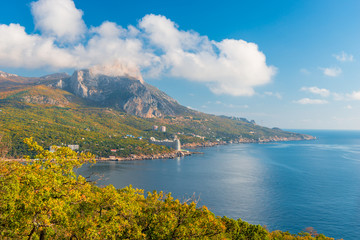 Fototapeta premium Top view of the bay of the sea and the mountain, beautiful clouds on a sunny day