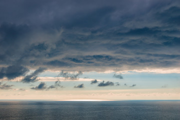Obraz premium Beautiful blue clouds over the sea dramatic seascape