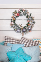 Christmas composition. Winter background. Christmas wreath. Handmade holiday wreath.family holiday concept. Merry Christmas and Happy Holidays. Bedroom with Christmas decor. Winter home decor.