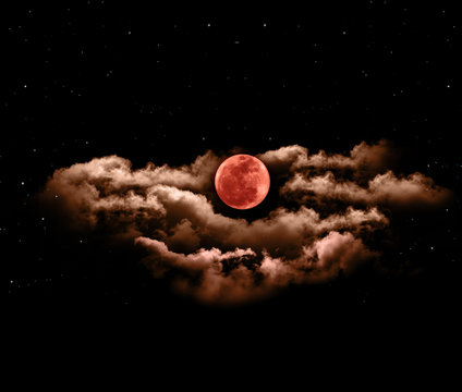 Lunar eclipse or blood full moon with clouds
