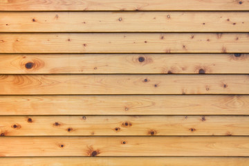 Obraz premium layer of horizontal natural pine wood planks strips wall background texture wide with natural eyelets and grunge