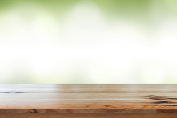 Empty of desk with blurred light green gradient bokeh abstract background