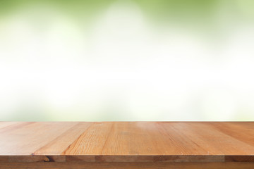 Empty of desk with blurred light green gradient bokeh abstract background