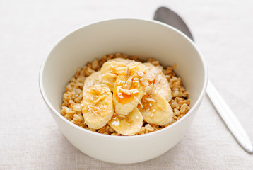 Bowl of oatmeal with sweet banana