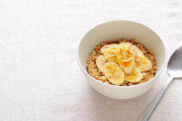 Bowl of oatmeal with sweet banana