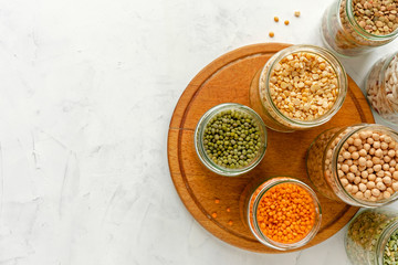 Assorted dry legumes and pulses in glass jars