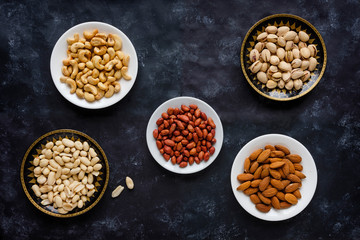 Individual dishes of roasted fresh nuts