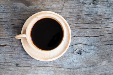 cup of coffee on wooden background