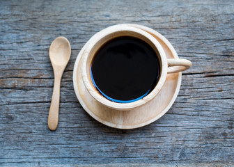 cup of coffee on wooden background