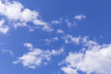 Obraz premium Blue sky background with white clouds, rain clouds on sunny summer or spring day.