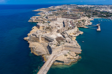 Fort Ricasoli aerial view. Island of Malta from above. Bastioned fort built by the Order of Saint John in Kalkara, Malta. Gallows' Point, north shore of Rinella Bay, entrance to the Grand Harbour. - obrazy, fototapety, plakaty