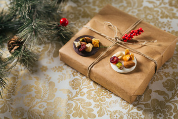 small chocolate lenten cookies and present on christmas decorated background