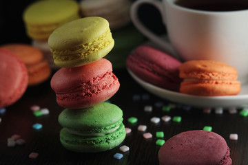 Bright macaroons against dark background