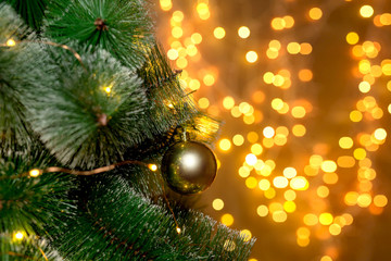 Obraz na płótnie Canvas Christmas tree on the background of blurry lights of Christmas garland. Christmas concept.
