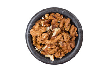 Walnuts in stone bowl on a white isolated background.