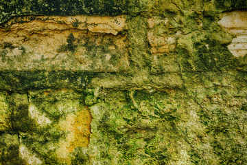 cracked brown and green concrete  walltexture background