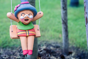 cute old woman clay doll  decorate in the garden