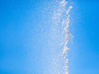 Splashes of water against the blue sky