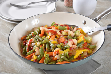 Shrimp stir fry in a wok