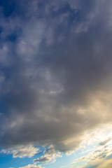Clouds after rain before sunset as a background