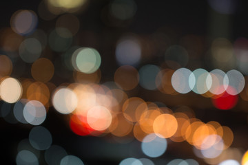Fototapeta premium Defocused city night light blurred with bokeh abstract background.