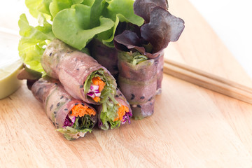 Fresh spring roll or Salad roll mixed by Vegetable carrot tuna on Chopping board in white background texture