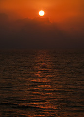 Landscape of sunset over the sea and clouds. Cloudy sky.