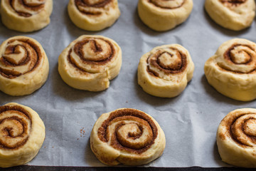 Obraz na płótnie Canvas cinnamon buns - Cinnabon cooking process. (food background). copy space