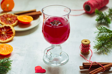 Mulled wine with spices and gifts on the table. Happy New Year! Top view