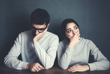 sad couple in table