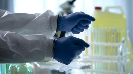 Lab assistant handcuffed for illegal drug dealing clandestine pharmaceutical lab