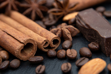 Spicy background. Cinnamon, chocolate, coffee beans and star anise