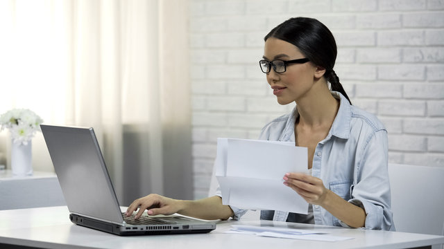 Woman Typing On Laptop At Home, Paying For Utilities Online, Easy Banking