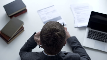 Fototapeta premium Lawyer providing advice by phone, correcting investigation report, top view