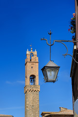 Old lamp on street in historic center of Montalcino. Italy