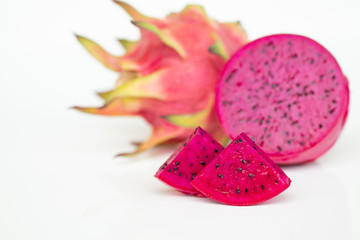 Fresh pitahaya fruit sliced on white background or ripe dragon fruit red color with copy-space design for drinks package design, healthy article picture and plantation guide book design