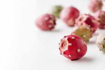 Prickly pear fruit on a white background, creative food concept, prickly pear cactus, Opuntia ficus-indica - obrazy, fototapety, plakaty