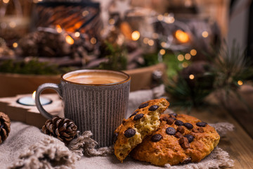 Fragrant hot coffee and chocolate cookies for Santa Claus. A drink for the holiday and a cozy Christmas atmosphere. Free space for text.