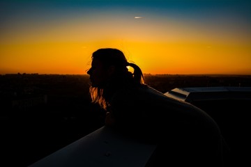 silhouette of woman on sunset