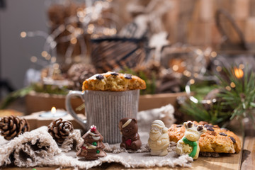 Fragrant coffee, chocolates in the form of Christmas figures. Cookies and hot drink for the holiday. Cozy atmosphere, candles decor. free space for text.