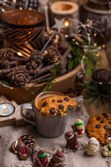 Fragrant hot coffee and chocolate cookies for Santa Claus. A drink for the holiday and a cozy Christmas atmosphere. Free space for text.