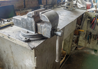 Vice on a workbench in a workshop. 