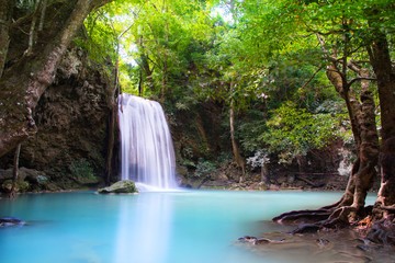 Fototapeta na wymiar Beautiful Waterfall in deep forest at Erawan waterfall National Park, Kanchanaburi, Thailand 