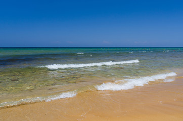 Soft wave of the sea on the sandy beach