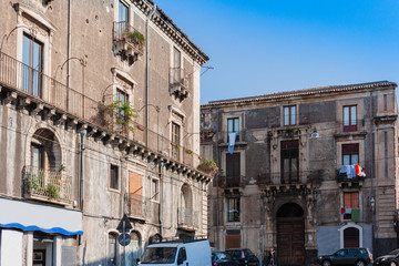 Travel to Italy -  historical street of Catania, Sicily, facade of ancient buildings